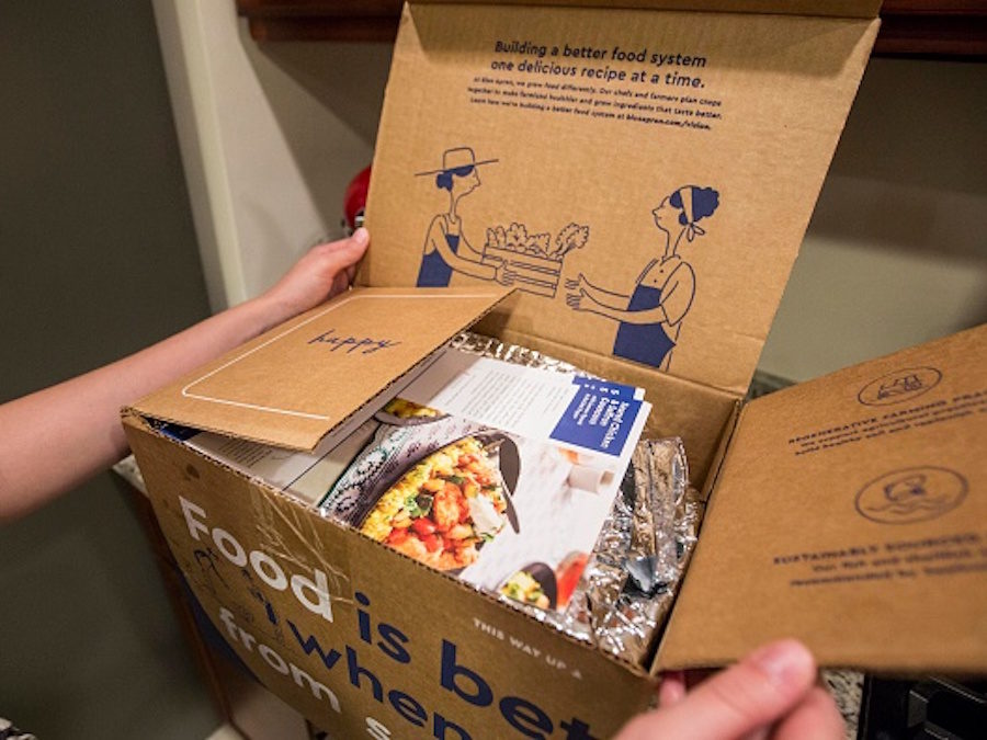 BOSTON, MA - JUNE 28: In this photo illustration, a Blue Apron customer unpacks a Blue Apron box on a kitchen counter on June 28, 2017 in Boston, Massachusetts.  The online meal-kit delivery company is going public and has lowered their upcoming IPO price range from $15 to $17 a share to $10 to $11 a share. (Photo by Scott Eisen/Getty Images)