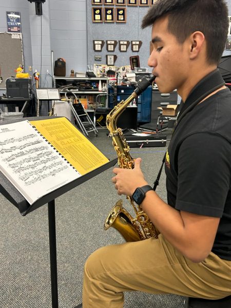 Josh Torres (11) practices a piece on his saxophone. In November, he earned 1st Band 1st Chair in All-Region Jazz. 