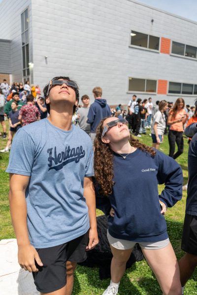 Students at Heritage admiring the solar eclipse on April 8. 
