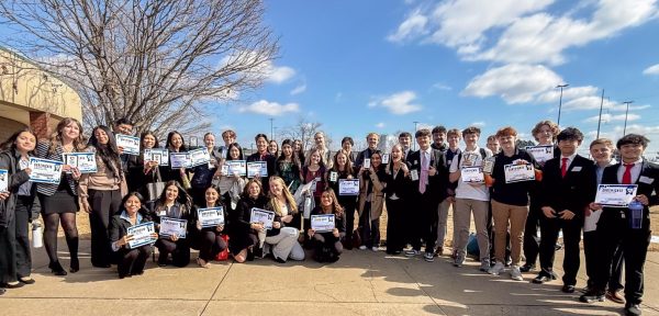 Students posing for a picture after winning many awards at the FBLA District Competition.