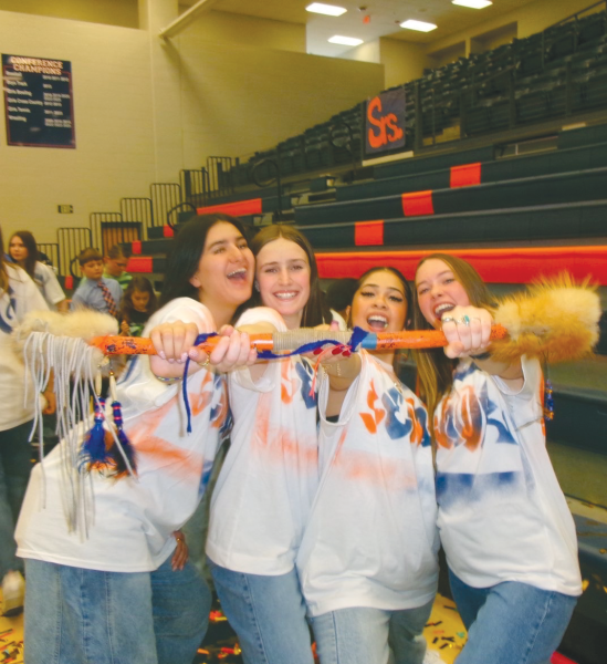 A group of seniors posing with the spirit stick after winning the Colors Day
dance battle.